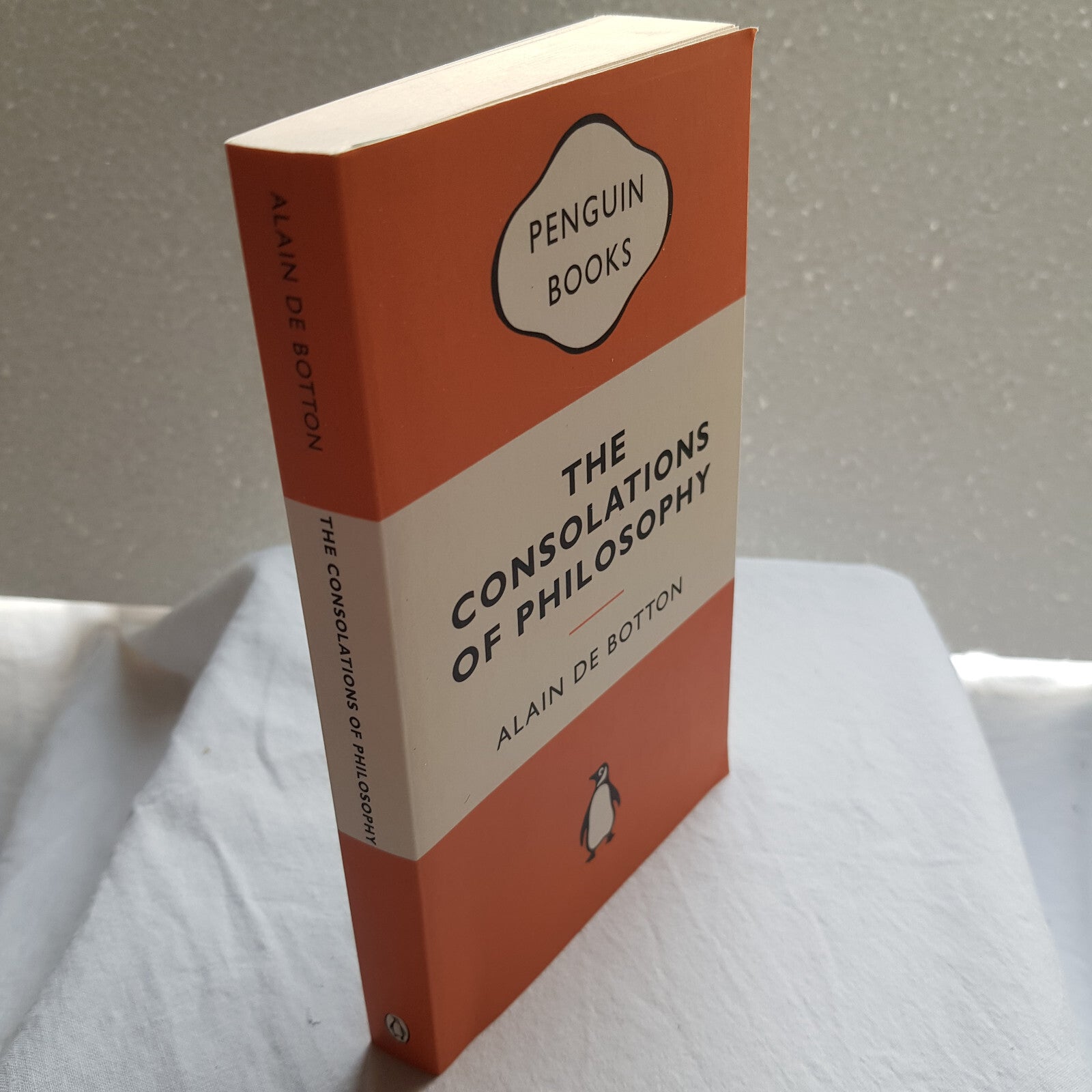 The consolations of philosophy by Alain De Botton - Penguin Books orange cover