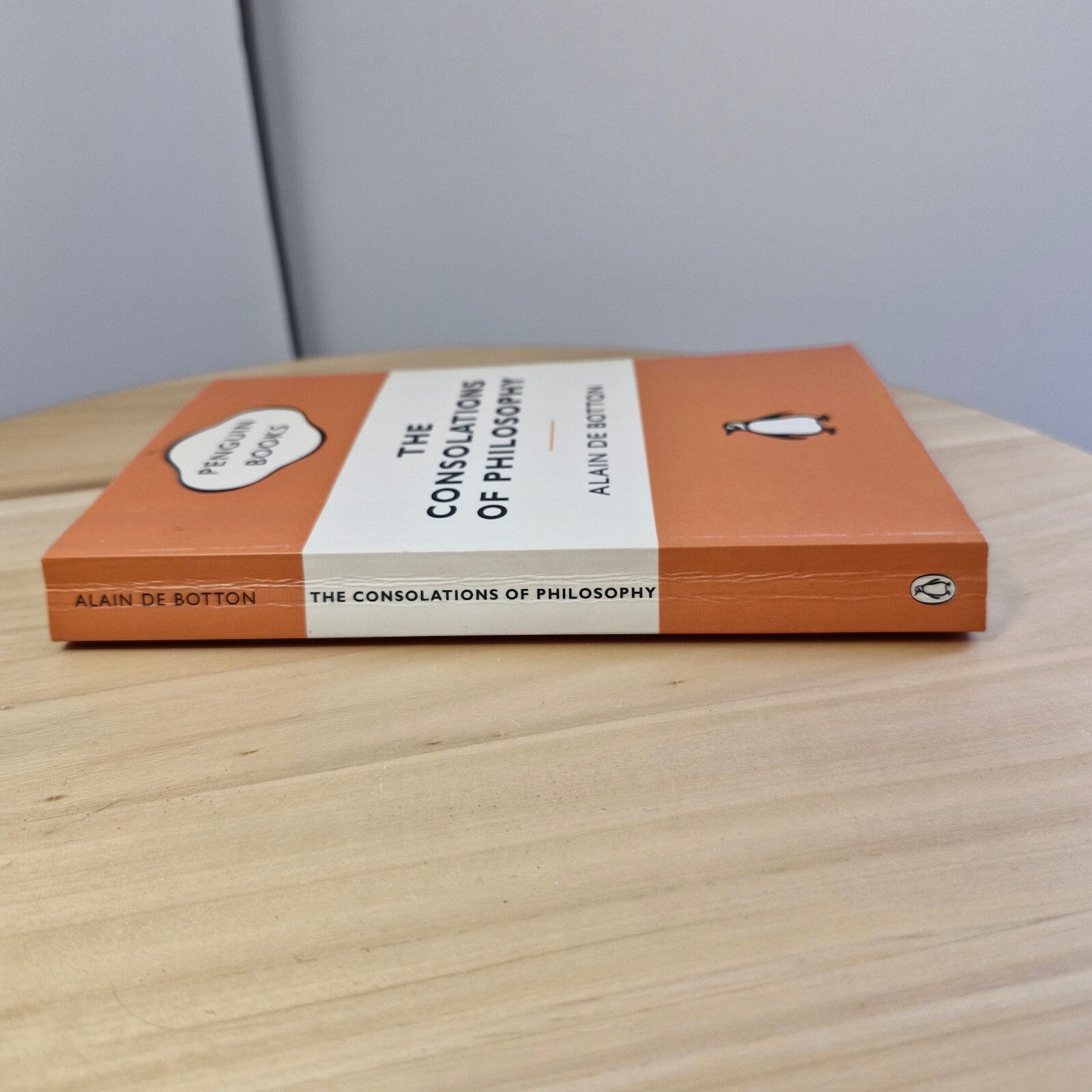 The consolations of philosophy by Alain De Botton - Penguin Books orange cover