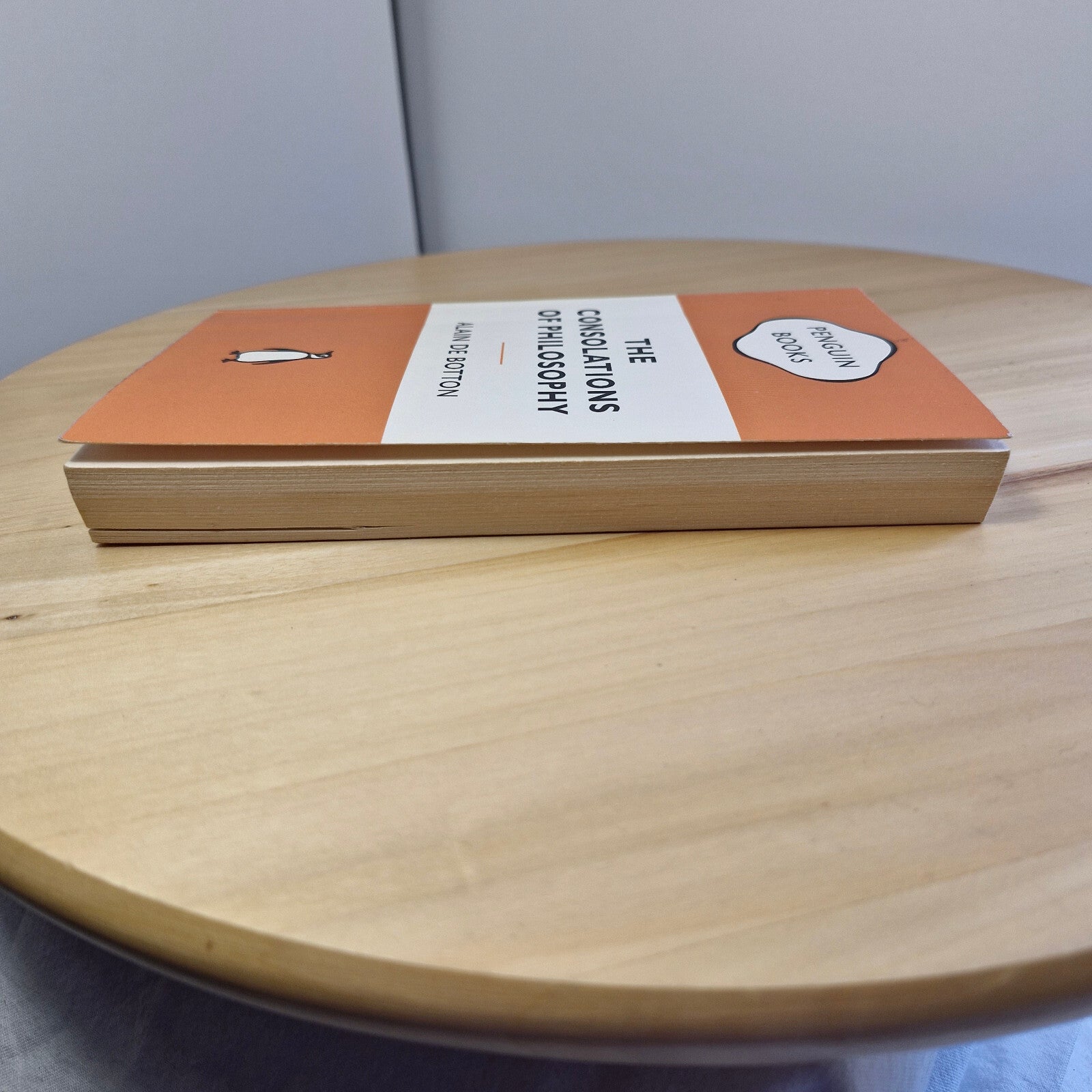 The consolations of philosophy by Alain De Botton - Penguin Books orange cover