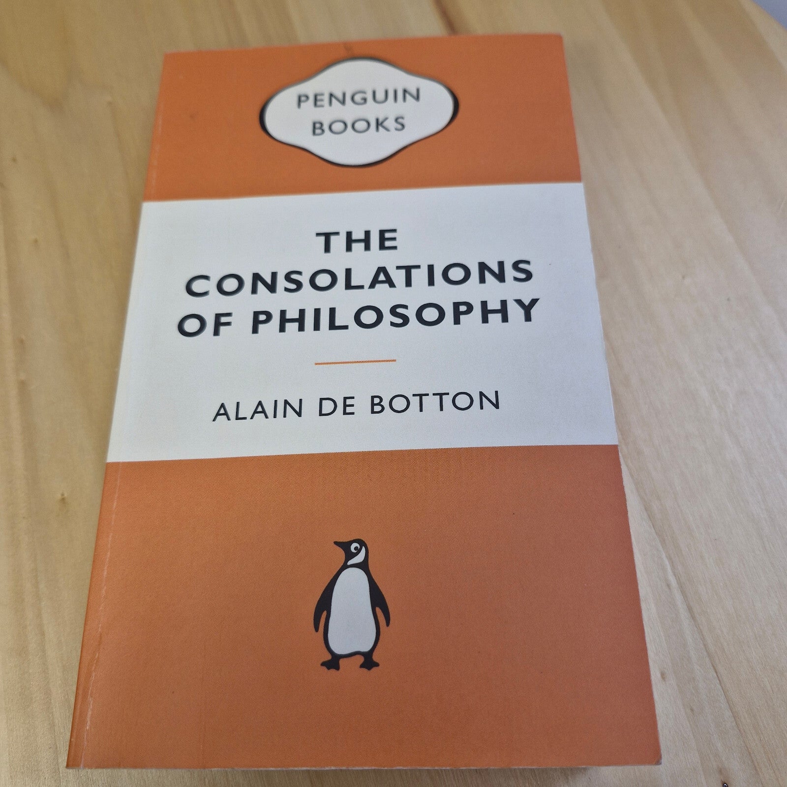 The consolations of philosophy by Alain De Botton - Penguin Books orange cover