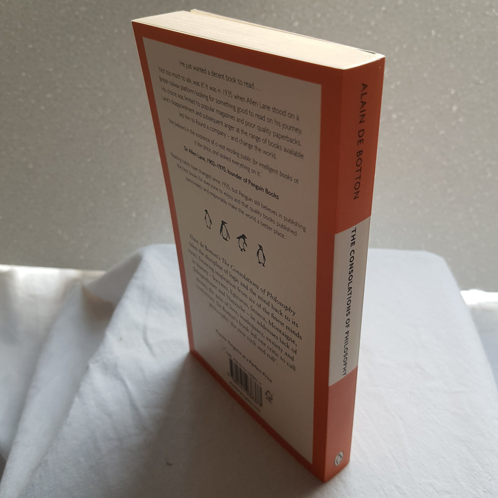 The consolations of philosophy by Alain De Botton - Penguin Books orange cover
