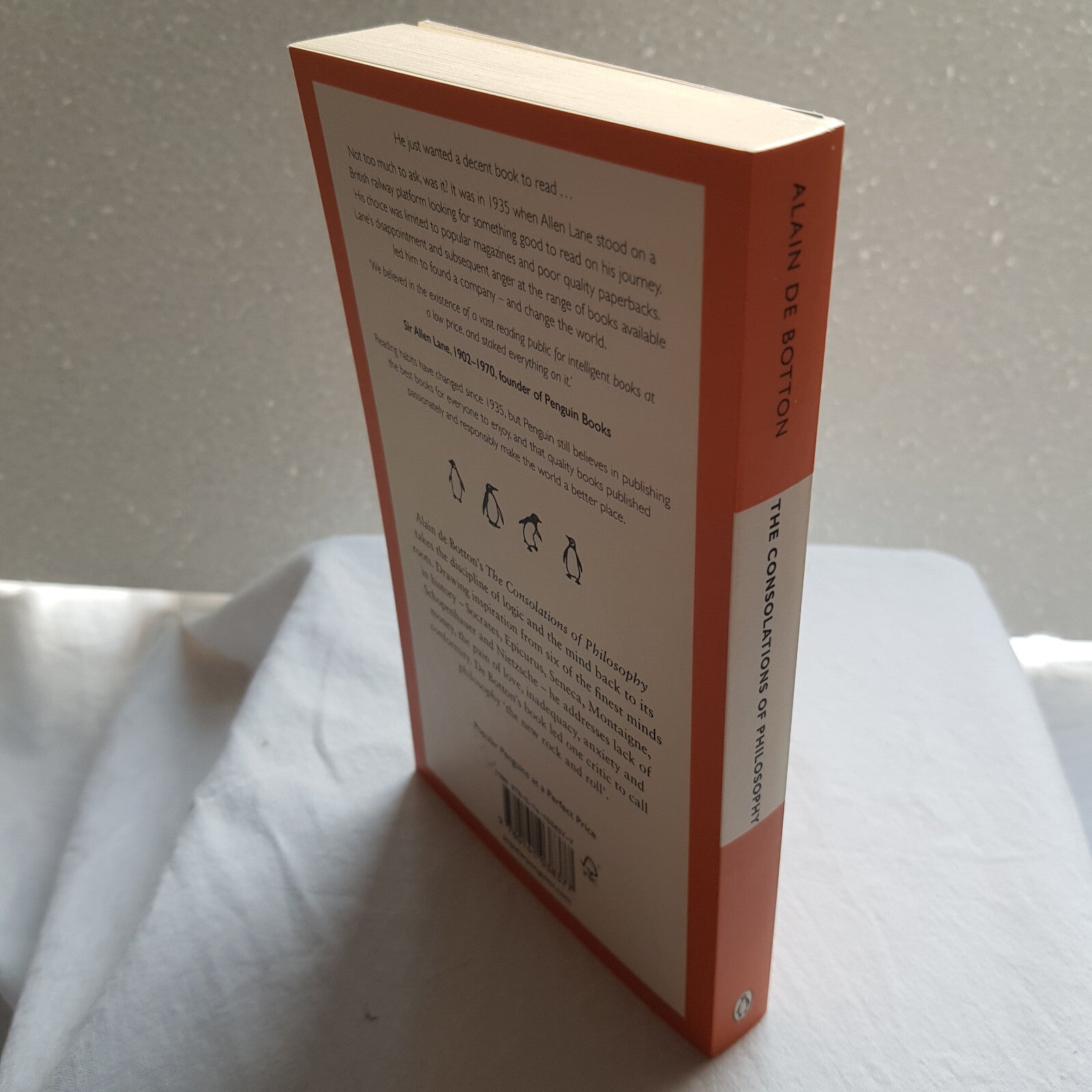 The consolations of philosophy by Alain De Botton - Penguin Books orange cover